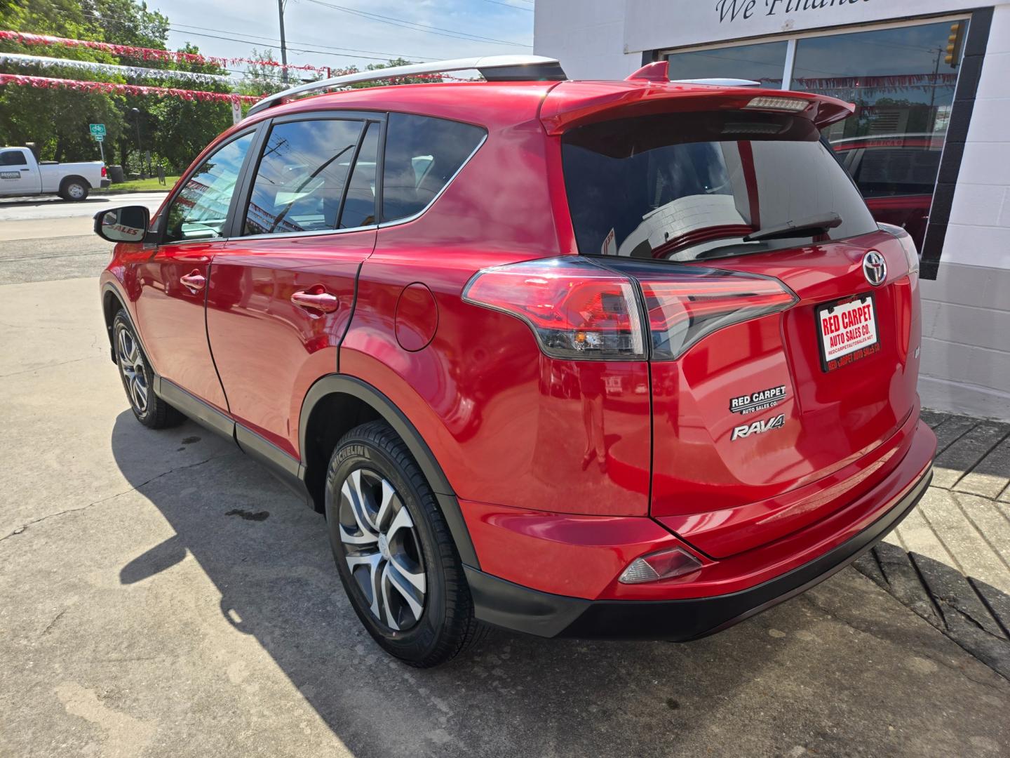 2017 Red Toyota RAV4 LE FWD (2T3ZFREV9HW) with an 2.5L L4 DOHC 16V engine, 6A transmission, located at 503 West Court, Seguin, TX, 78155, (830) 379-3373, 29.568621, -97.969803 - Photo#3